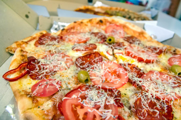 Pizzas fresh delivered to workers at the office