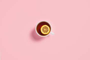 Cozy autumn composition. Tea cup with slice of lemon.