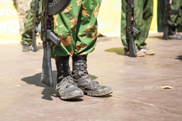 The guy in uniform. Khaki clothes. Training soldiers with weapons. Demonstration performance of the...