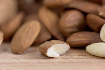 Obraz premium Almond nuts with white milk macro