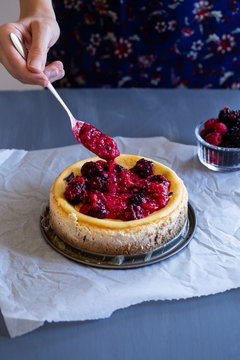 Topping a Berry Cheesecake 