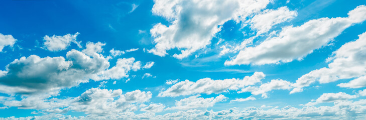 Beautiful blue sky and white cumulus clouds abstract background. Cloudscape background. Blue sky and fluffy white clouds on sunny day. Nature weather. Bright day sky for happy day background. - obrazy, fototapety, plakaty