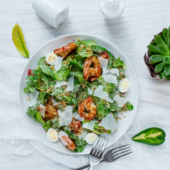shrimp ceasar salad on the table
