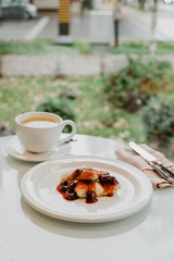 breakfast in a cafe overlooking the street