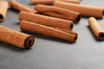 Cinnamon sticks on the gray stone texture with copy space	