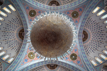 Naklejka premium Ankara, Turkey - Inside interior view of the Kocatepe Mosque (Kocatepe Cami), featuring its ornate domes, pillars and windows.
