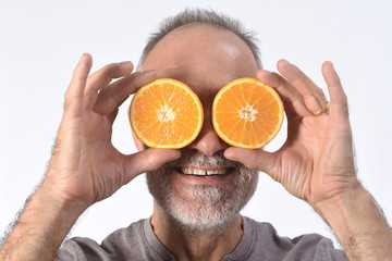 man with orange fruit on white background