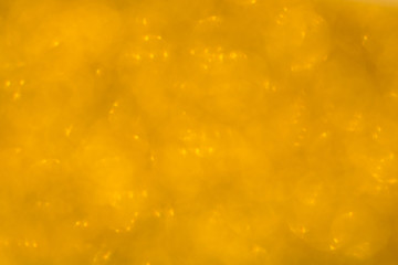 Delicate golden texture bokeh background. blurred yellow autumn background