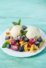 belgian waffles with ice cream and berries