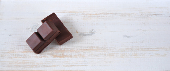 Dark Chocolate Bars on Wooden Background