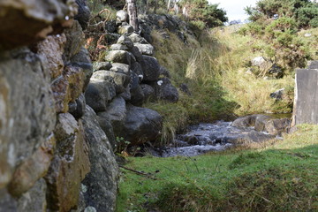 stone wall and small river countryside