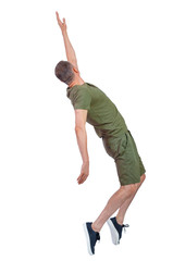 Side view of a man dancing in shorts.