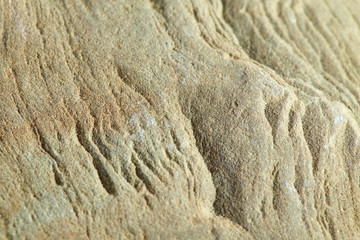 Smooth texture of yellowish-greenish natural stone. Natural backgrounds and textures. The design and decor.