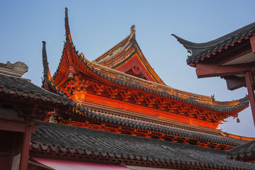 Naklejka premium The upper structure of the Confucius Temple at sunset over Nanjing