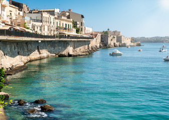 Fototapeta na wymiar View of the seaside in the old city of Ortigia (part of the city of Siracusa, Italy, Sicily).
