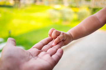 Concept of love and family. hands of mother and baby closeup