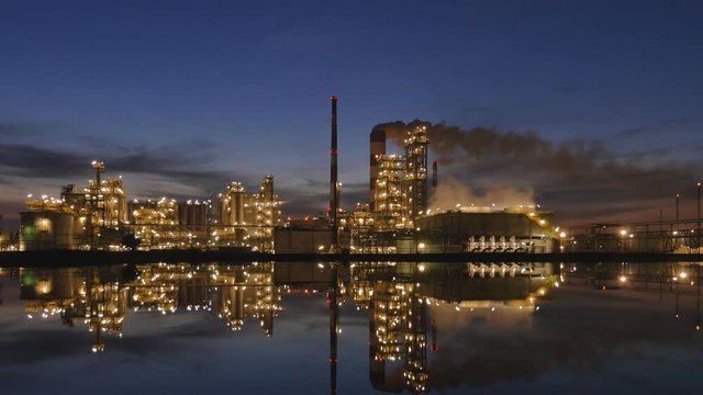 Illuminated refinery at night - zoom in