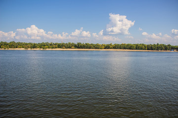 Tour of Kiev in the center of Europe. View of the Dnieper, Trukhanov island and a foot bridge. Park fountain and sunset on the horizon..