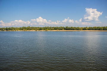 Tour of Kiev in the center of Europe. View of the Dnieper, Trukhanov island and a foot bridge. Park fountain and sunset on the horizon..