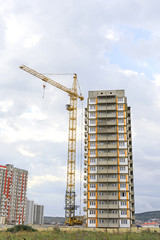 Fototapeta na wymiar .high-rise building construction. Construction crane against the sky. House under construction