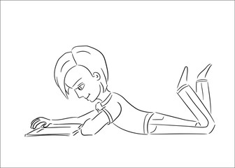 cute boy lying on his belly reading a book