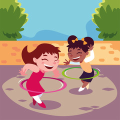 girls smiling and playing with hula hoop