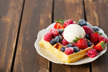 belgian waffles with ice cream and berries
