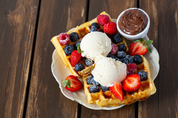 sweet belgian waffles with berries and ice cream