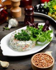 capital salad with green on the table