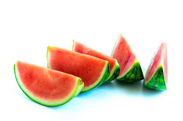 Studio shot heap of long slice cuts of mini organic watermelon isolate on white