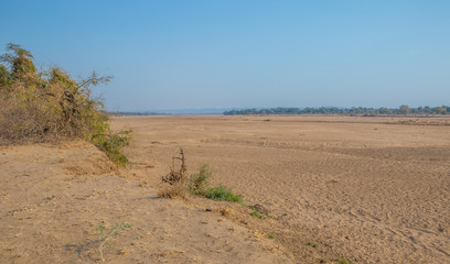 Dry river bed of the Limpopo river at Crooks Corner where Zimbabwe, Mozambique and South Africa's borders meet image in horizontal format with copy space