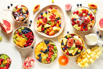 Different tasty salad with fruits on white background