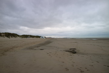 footprints in sand Dunkirk beach 