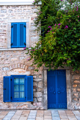 Fototapeta na wymiar Traditional Bodrum Aegean architecture style blue windows and door in Bodrum.