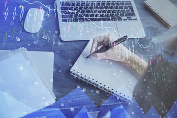 Forex chart displayed on woman's hand taking notes background. Concept of research. Multi exposure