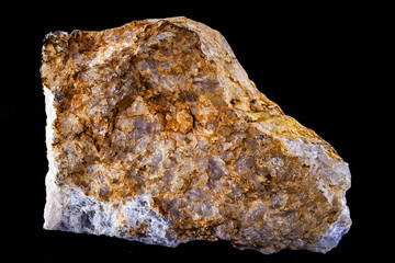 Brown stones isolated on black background - mineral derived partly from mountain explosion. Mining concept