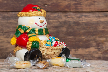 Christmas background concept. Christmas decorations in various colors on a brown wooden floor.