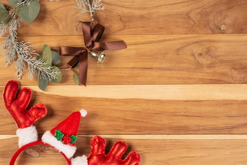 Christmas background concept. Christmas decorations in various colors on a brown wooden floor.