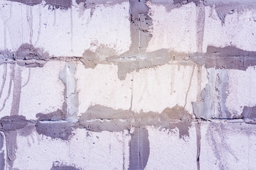 Close up of the white brick wall surface texture background and Traces of putty plaster construction of a new home