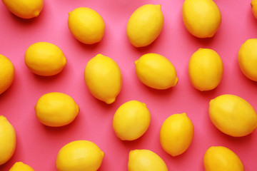 Ripe lemons on color background