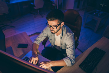 Photo of it specialist guy working late hours sit chair look many monitors write secure code for...