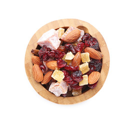 Bowl with different dried fruits and nuts on white background