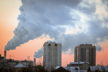 smoke from the pipes of the plant in winter pollution