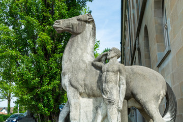 Sculpture at the entrance to the main building of the University of Zurich. The University of Zurich is the largest and university in Switzerland, founded in 1833