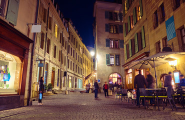 Fototapeta na wymiar Urban landscape at night. Restaurant in the old town in Geneva, Switzerland.