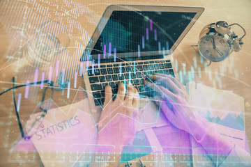 Multi exposure of forex graph with man working on computer on background. Concept of market analysis.