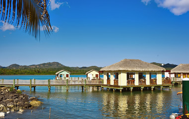 Cabanas on the water in luxury tropical resort on sunny day
