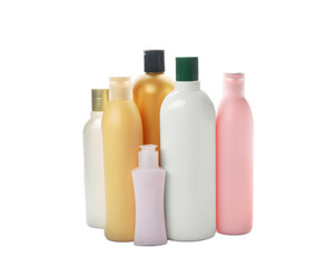 Bottles with cosmetic products on white background. Mockup for design