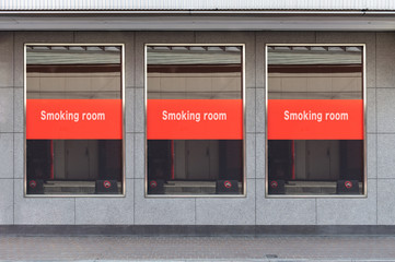 Smoking area zone:Unidentified poeple smoke in designated smoking area . Smoking and waking is strictly prohibited in most of the public area