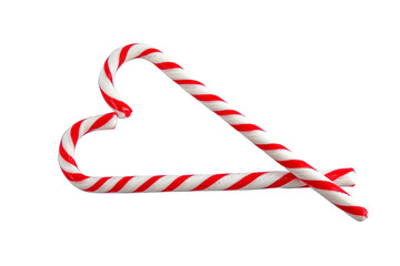 Candy canes on white background, top view. Traditional Christmas treat